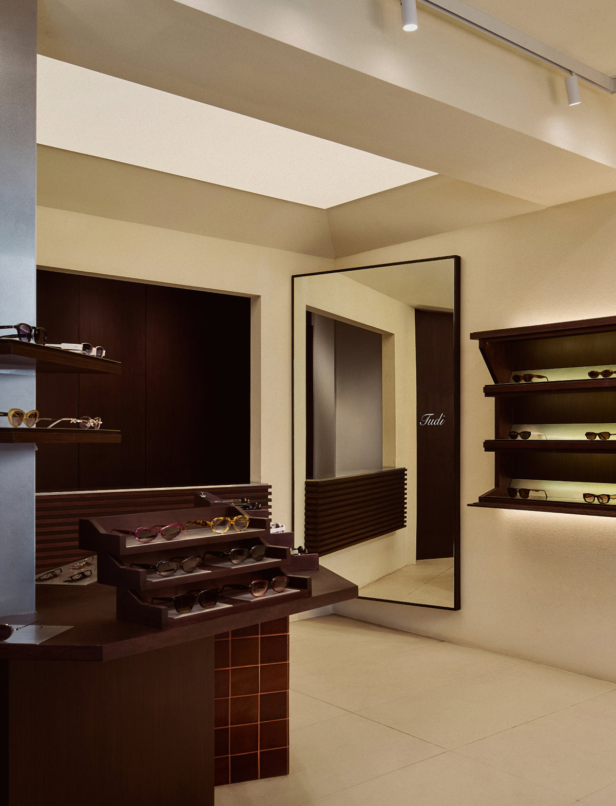TUDI store interior with eyewear displays and a glass counter