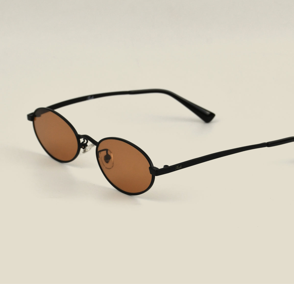 TUDI Juless Black with orange lenses eyewear, three-quarter side view