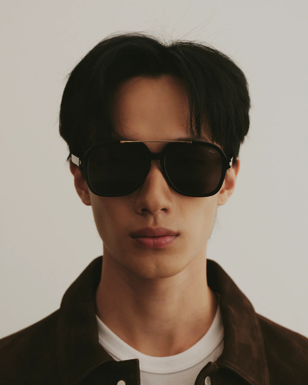 TUDI Blake eyewear, lifestyle, black frame; dark lenses