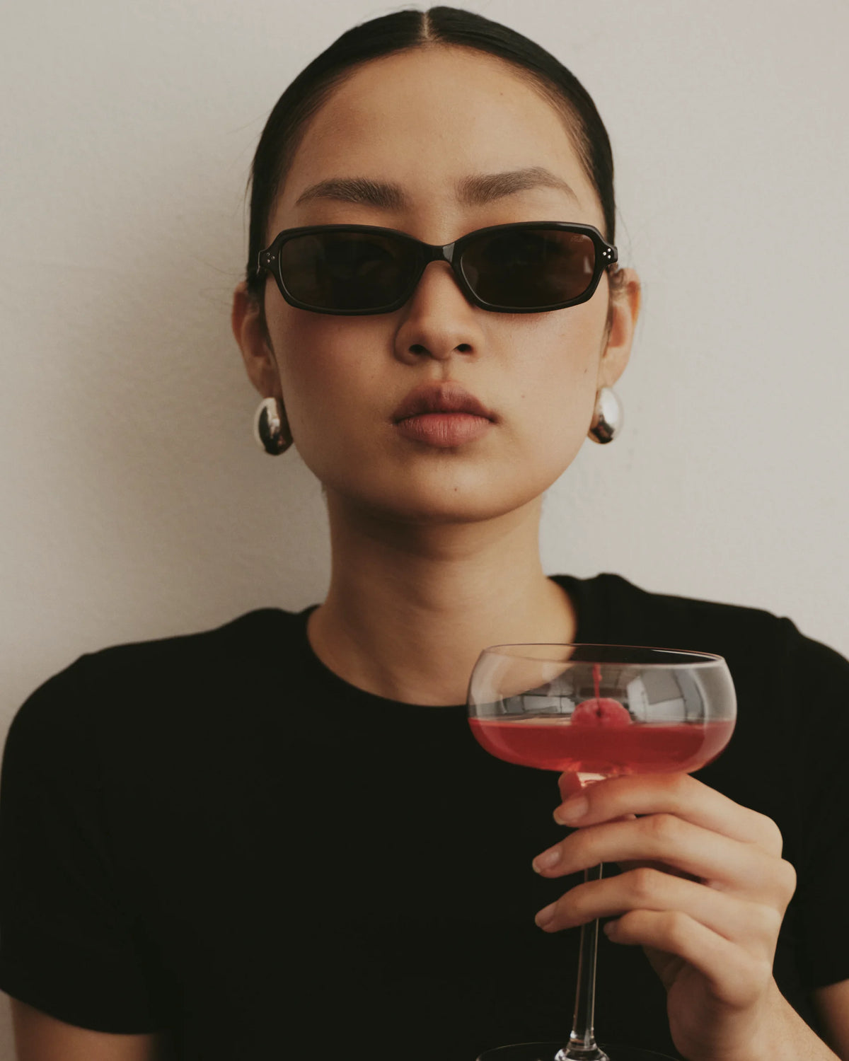 TUDI Elio eyewear, lifestyle, dark havana frame; dark brown lenses
