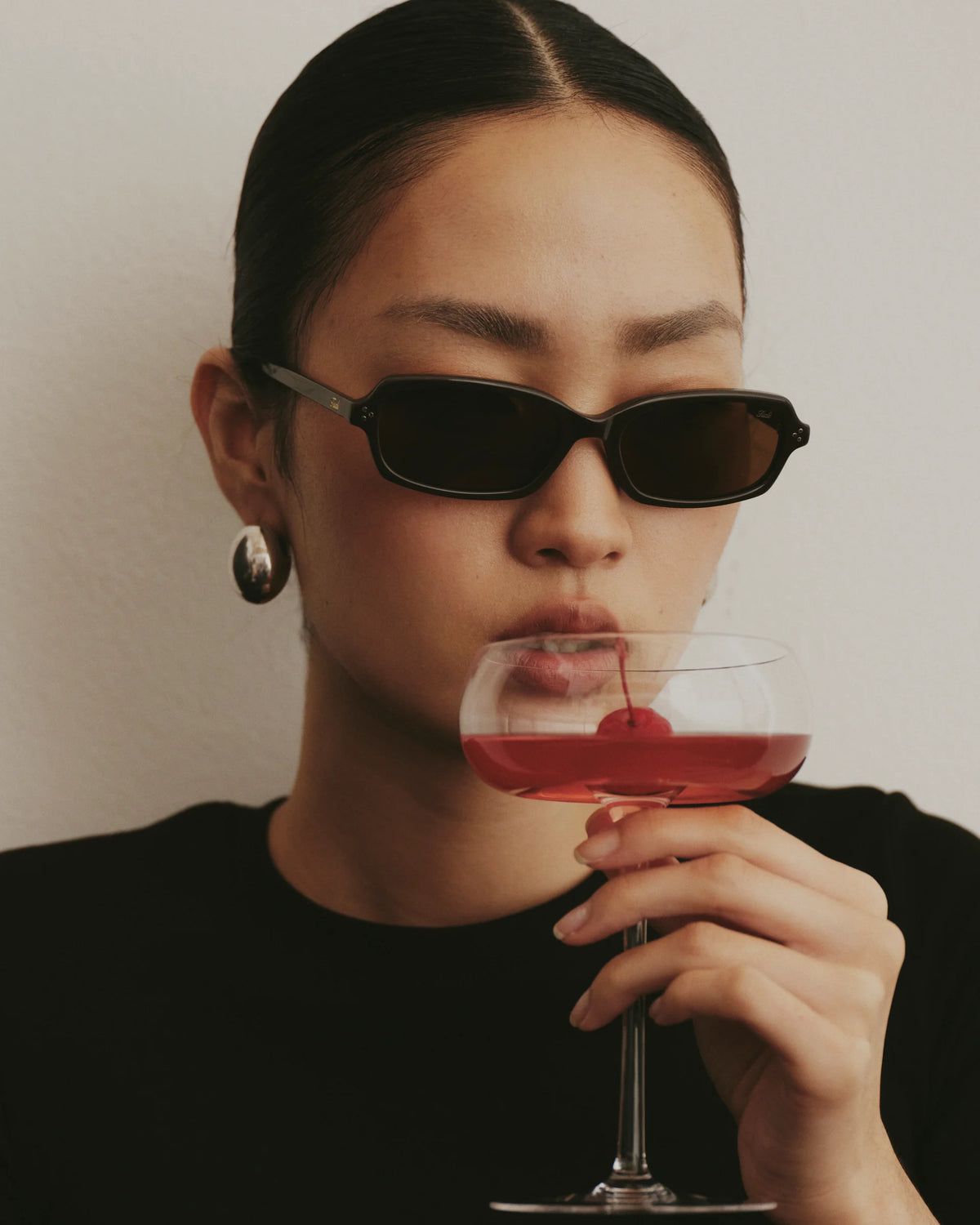 TUDI Elio eyewear, lifestyle, dark havana frame; dark brown lenses