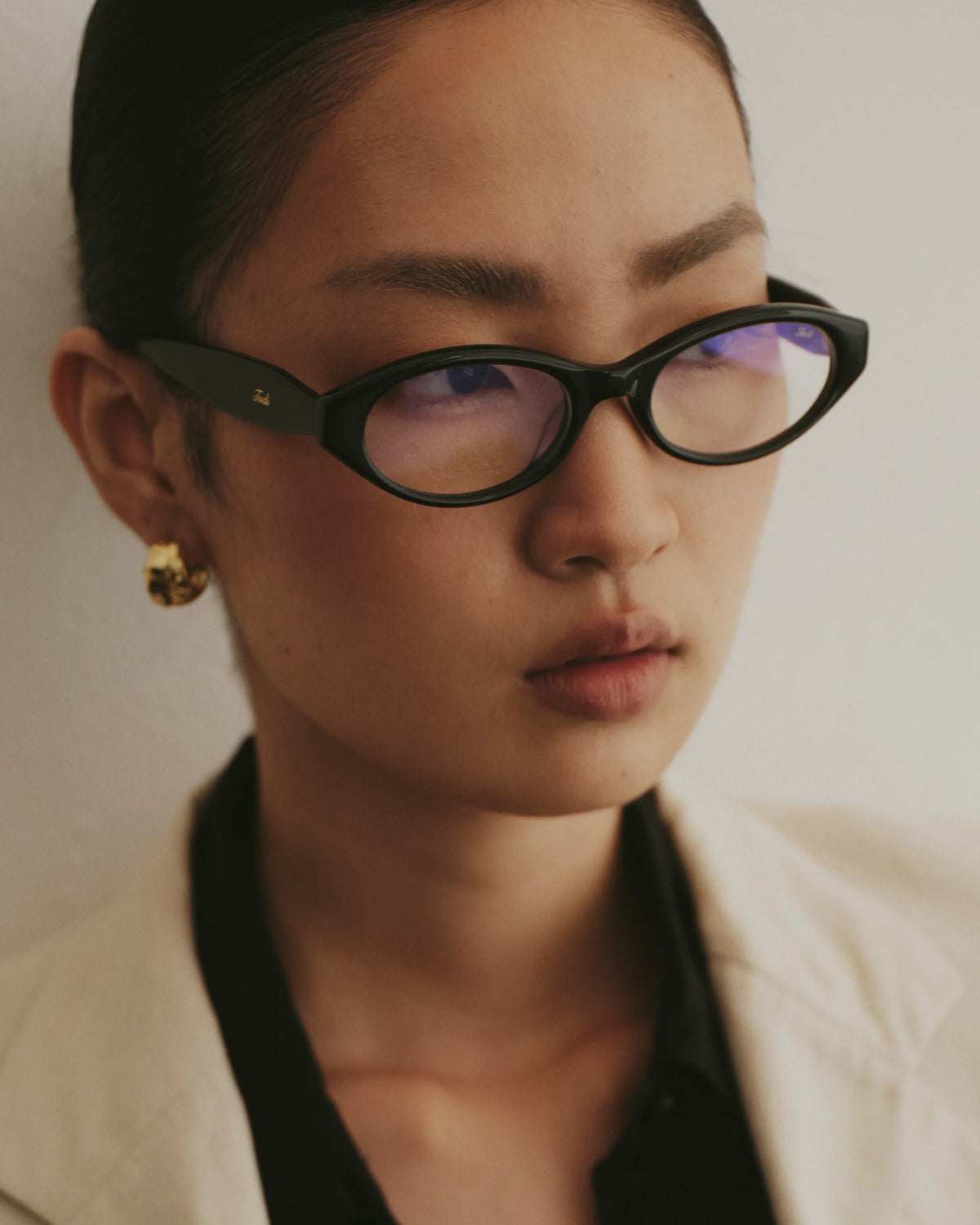 TUDI Jolie eyewear, lifestyle, black frame; clear lenses