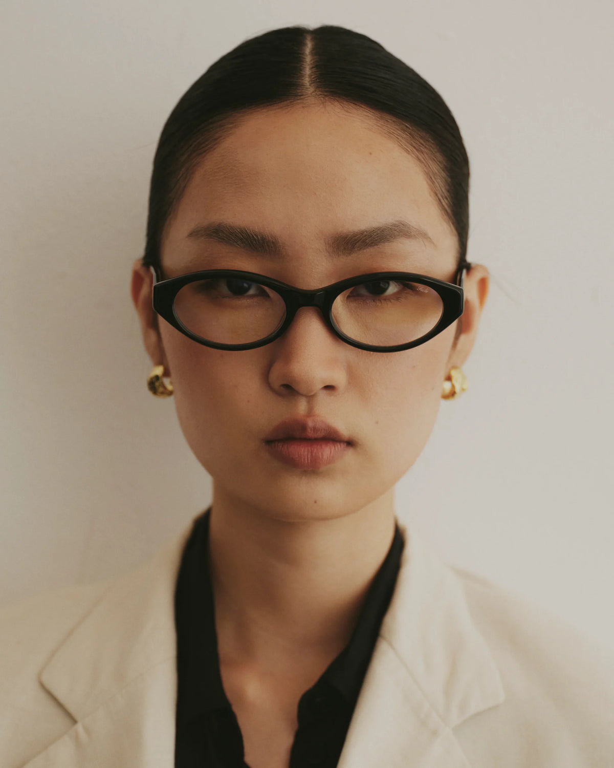 TUDI Jolie eyewear, lifestyle, black frame; clear lenses