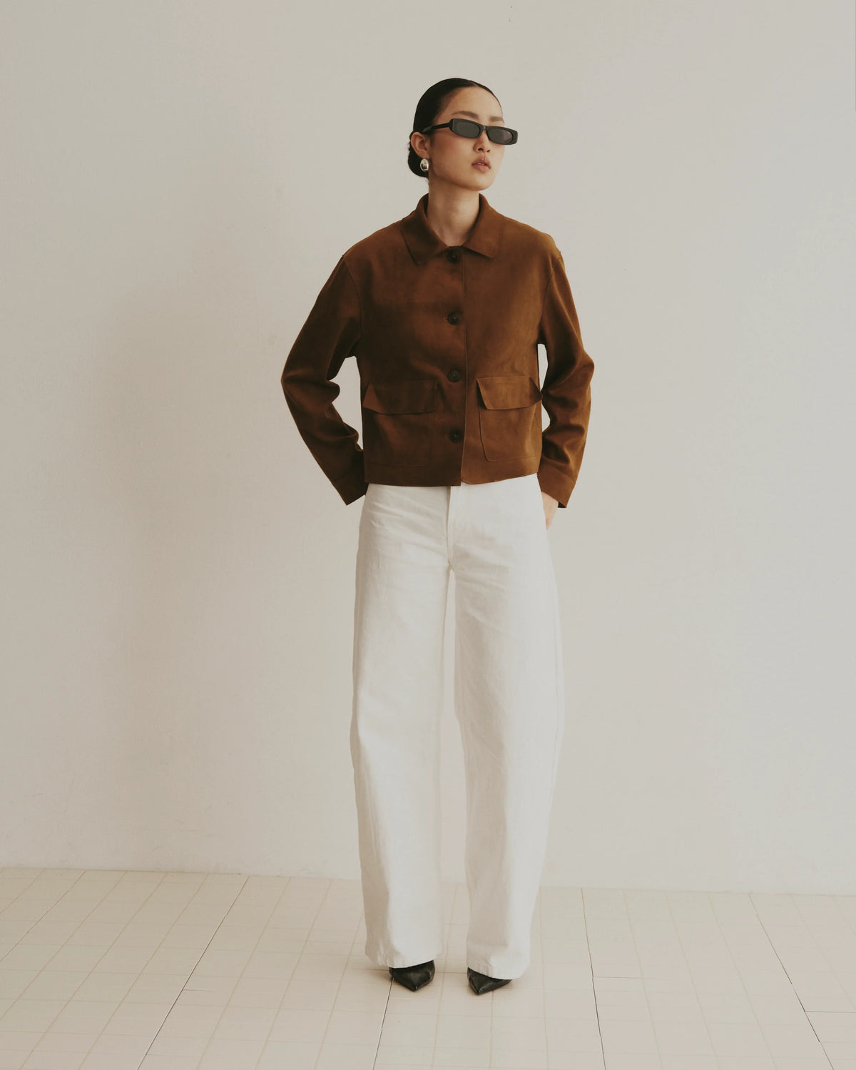 TUDI Kai eyewear, lifestyle, black frame; dark lenses