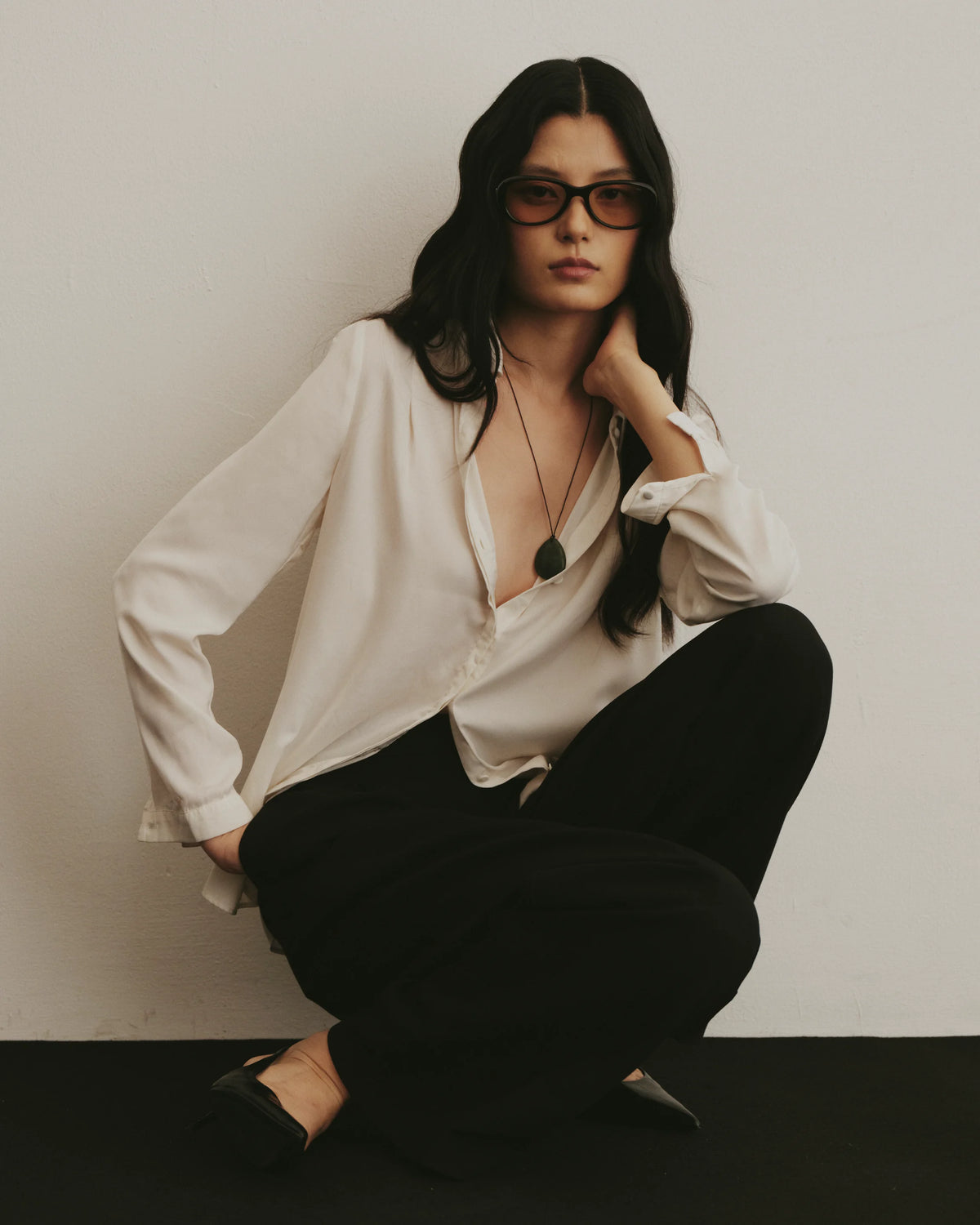 TUDI Nook eyewear, lifestyle, black frame; rose-tinted lenses