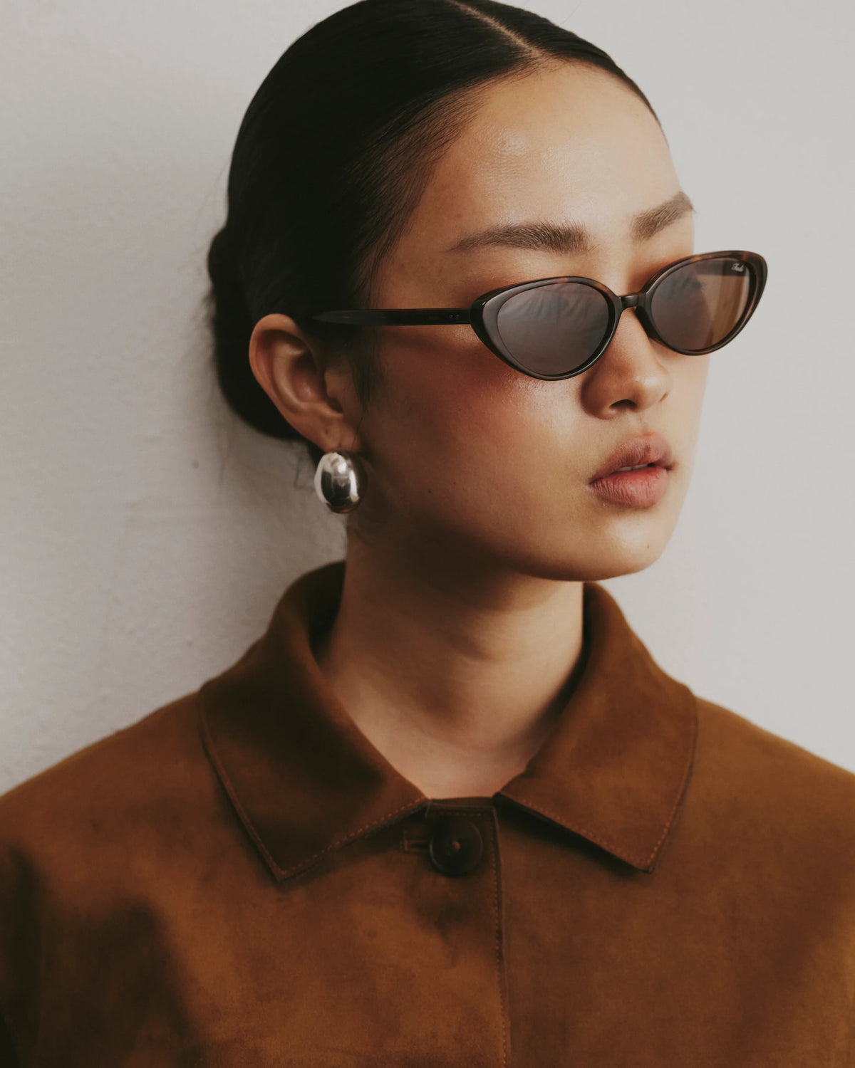 TUDI Nuna Brown tortoiseshell frame; dark lenses eyewear, lifestyle