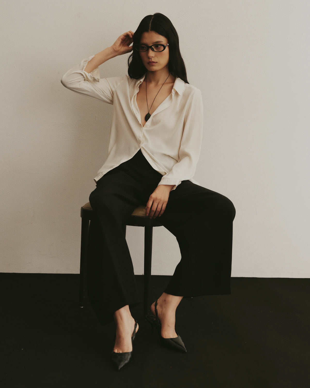 TUDI Pearl eyewear, lifestyle, black frame; clear lenses