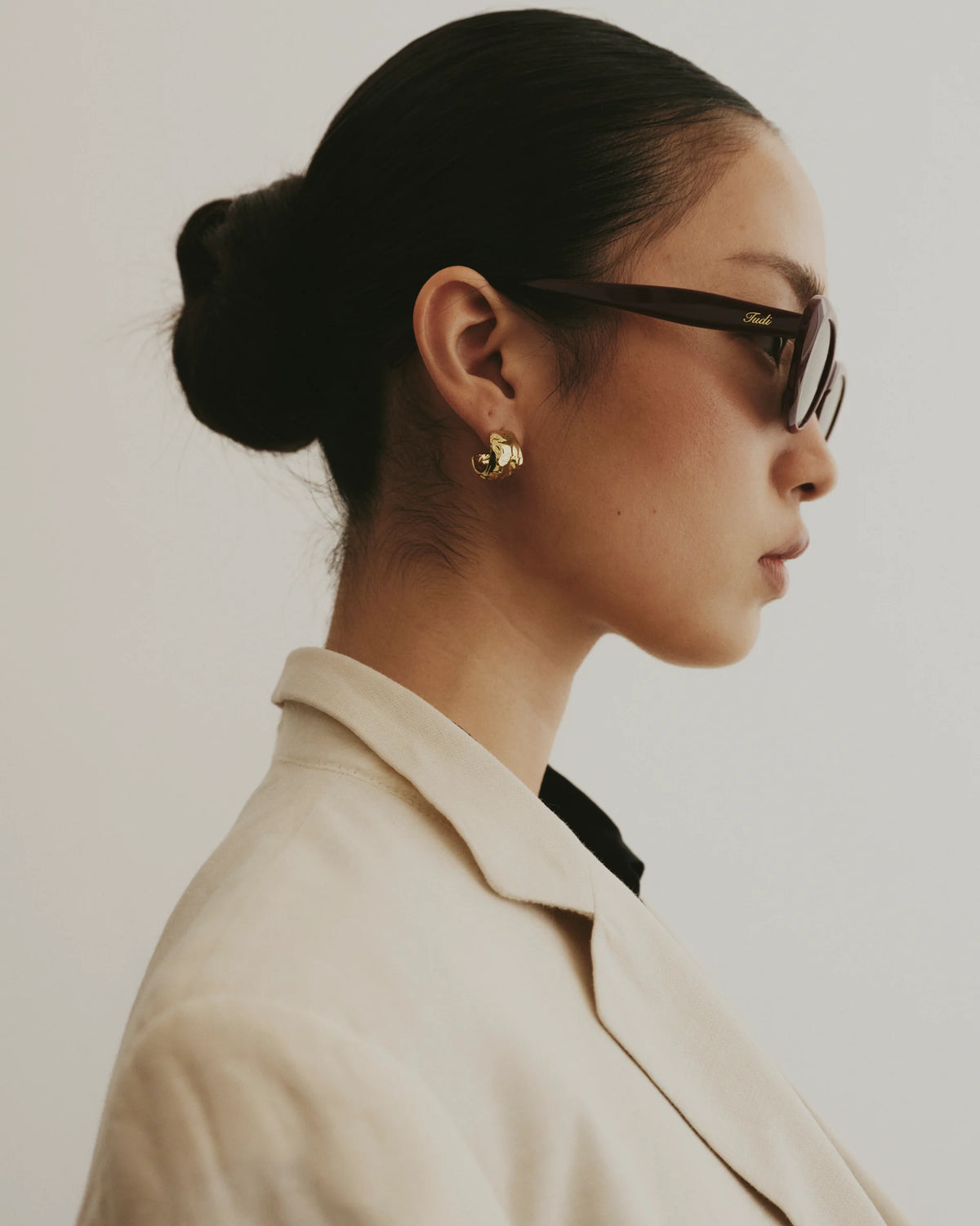 TUDI Pinta Burgundy-purple frame; dark lenses eyewear, lifestyle