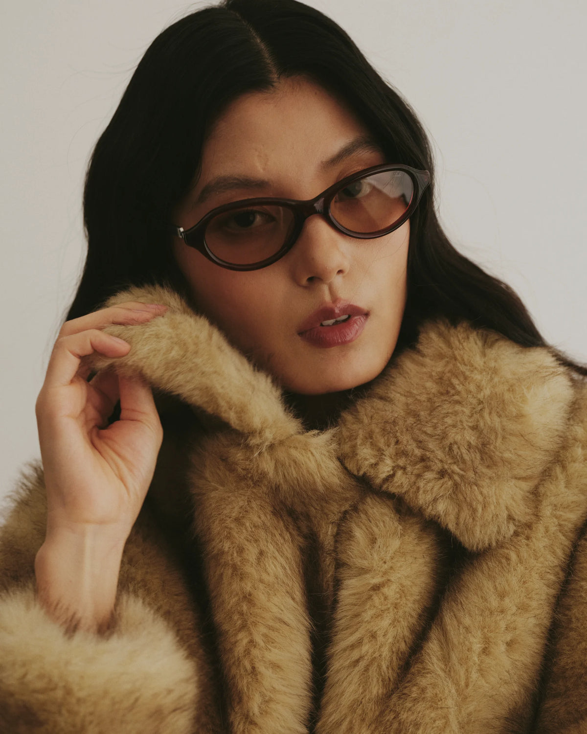 TUDI Riko eyewear, lifestyle, wine-red frame; rose-tinted lenses